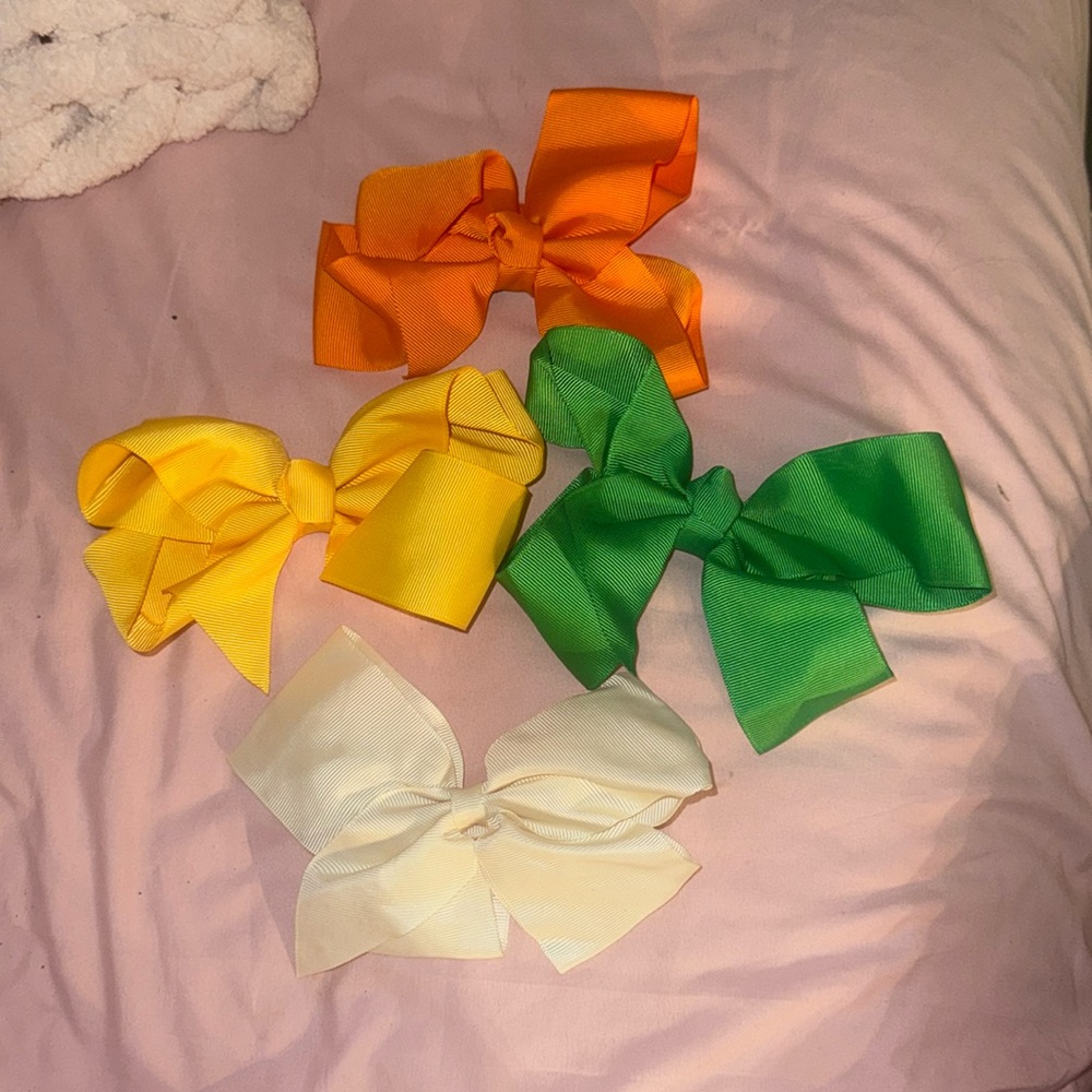 four cute and colorful bows
